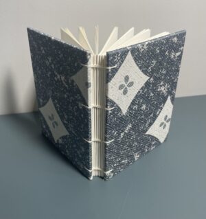 coptic stitch book with blue/gray diamond cloth