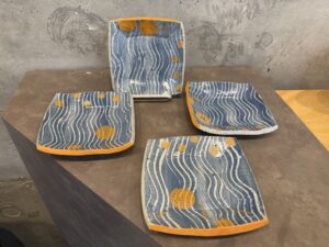 small blue dishes with orange